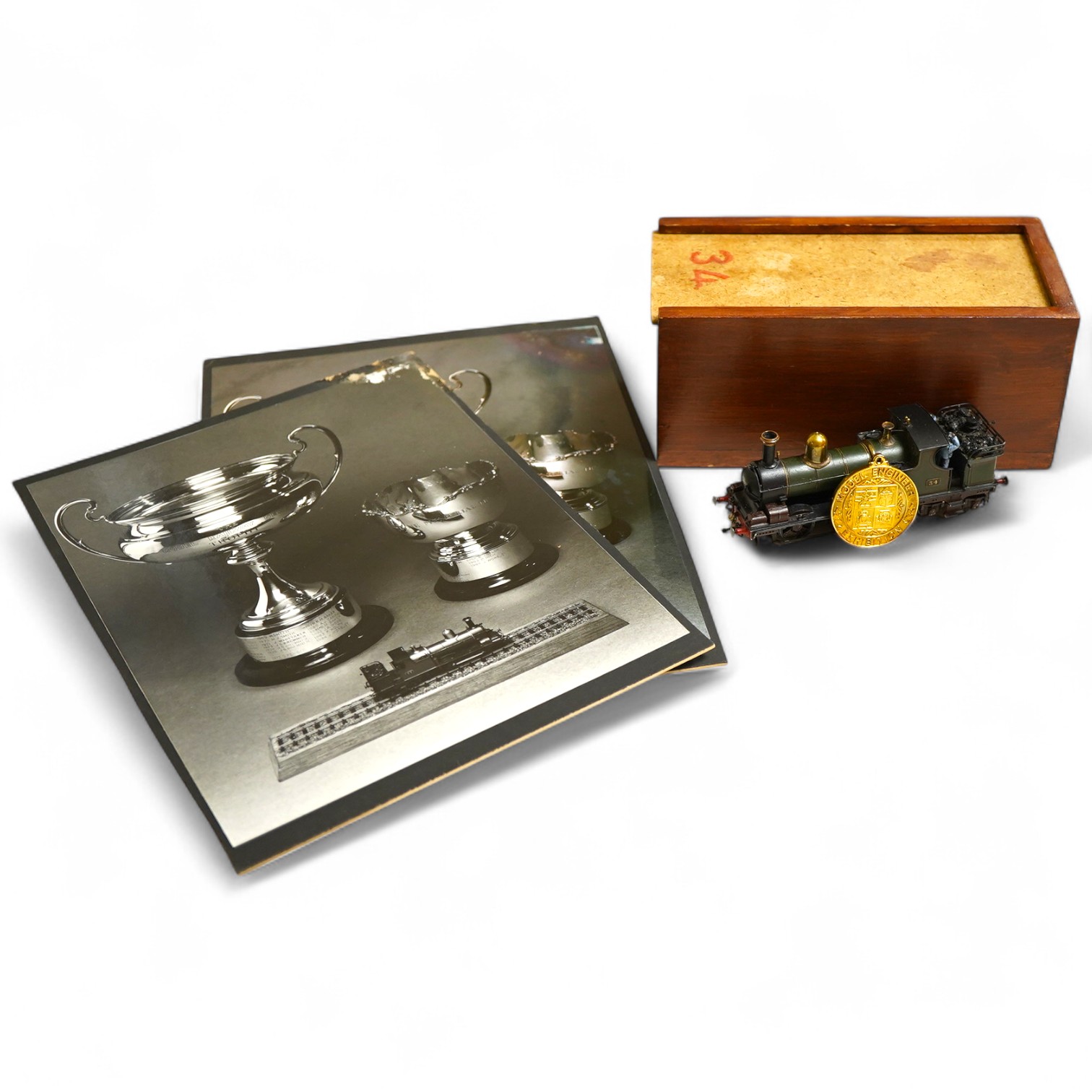An award winning EM gauge scratch built model railway locomotive by John Worsley, GWR Dean 0-4-4T, 34, rebuilt for the Woolmer Instructional Military Railway (later the Longmoor Military Railway), together with the medal